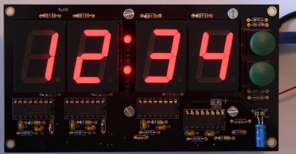 [large 4-digit LED display, in use]